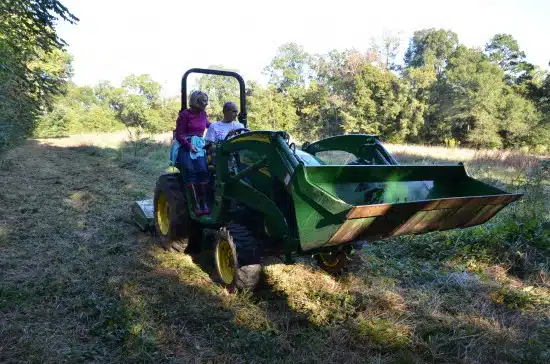 mom and dad on the tractor